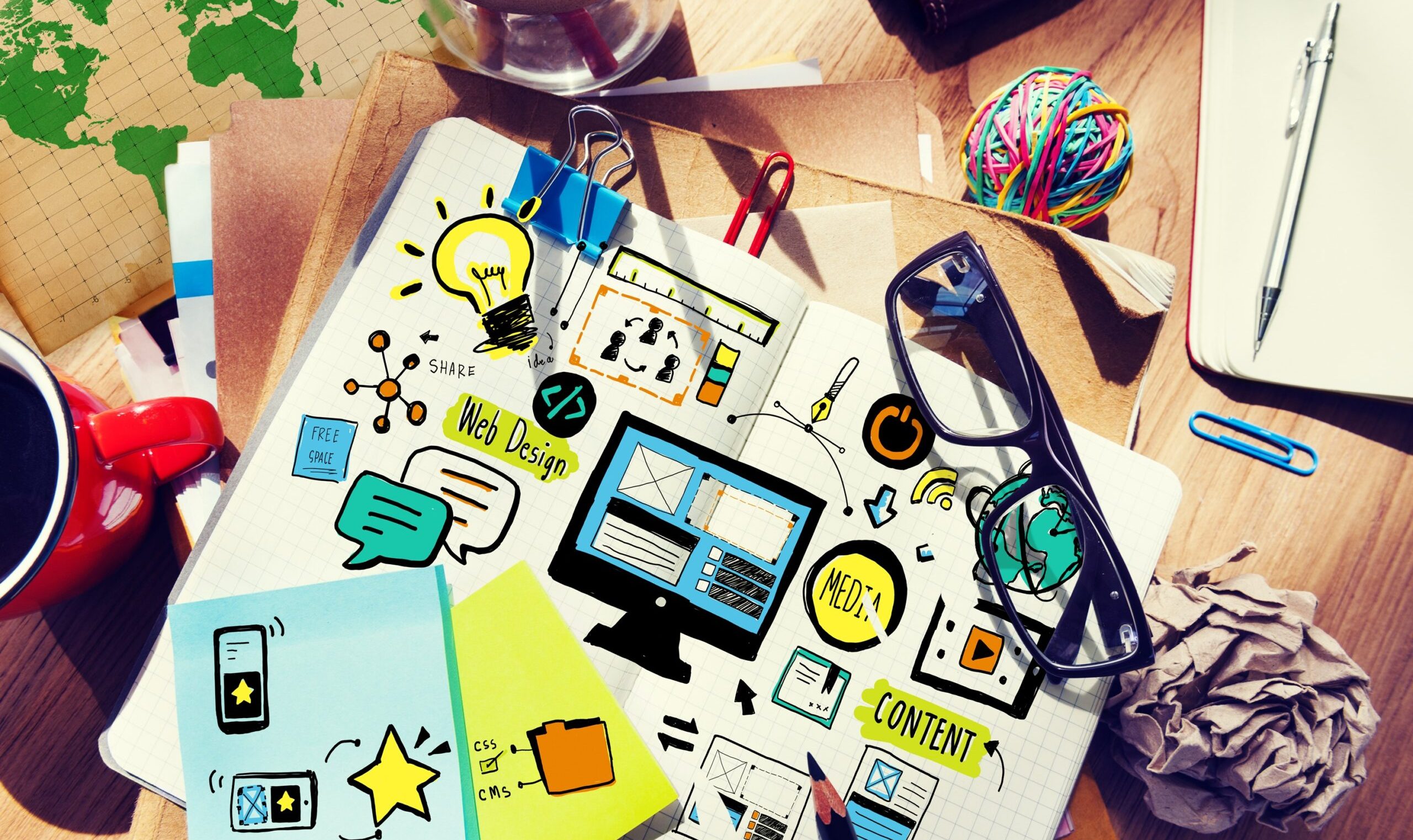 Aerial view of website content layout design illustraion on note Aerial view of website content layout design illustraion on notebook